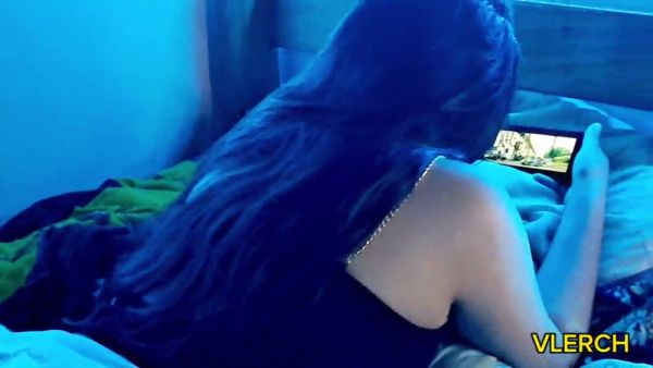 Young Latina teen caught watching steamy content on her phone in blue-lit bedroom on breastful.com