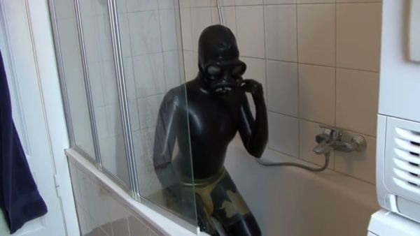 Latex-clad woman explores breathplay and self-restraint in a stark white bathroom - Germany on breastful.com