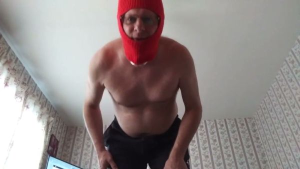 Masked muscular man in red balaclava jerks off on camera on breastful.com