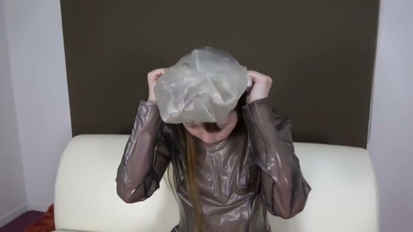 Japanese woman in shiny PVC dress explores breathplay and self-bondage on white leather couch - Japan on breastful.com