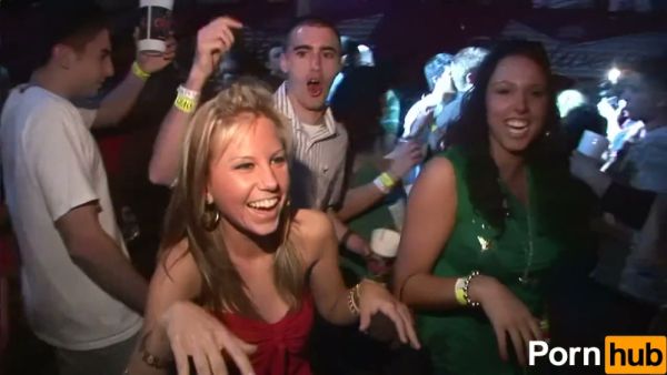 Two wild party girls in lingerie tease the crowd at a neon-lit nightclub on breastful.com