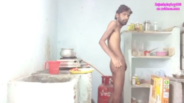 Skinny dark-skinned man jerks off and fingers his ass while cooking in a messy kitchen on breastful.com