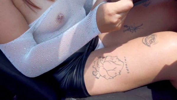 Curvy tattooed woman in leather skirt gives stranger oral in car doorway on breastful.com