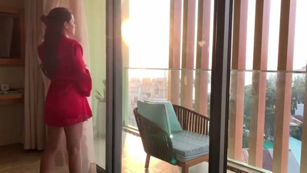 Voluptuous brunette Vina Moon pleasures her redheaded lover on the balcony at sunset on breastful.com