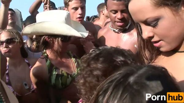 College beach party heats up with bikini teasing and passionate kissing among sun-soaked students on breastful.com