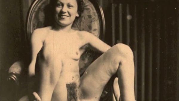 A hairy vintage couple explores passion in a sepia-toned boudoir on breastful.com