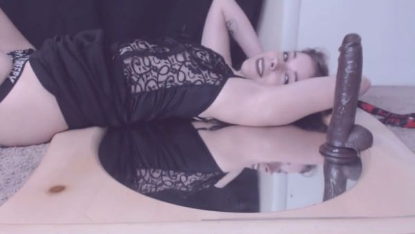 Hairy solo girl rides a thick black dildo in front of a round mirror on breastful.com