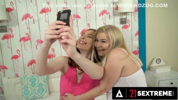 Mature lesbian lovers share passionate cunnilingus under pink flamingo wallpaper on breastful.com