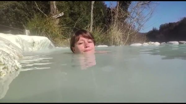 Young brunette basks nude in the natural thermal pools of Petriolo, Tuscany - Italy on breastful.com