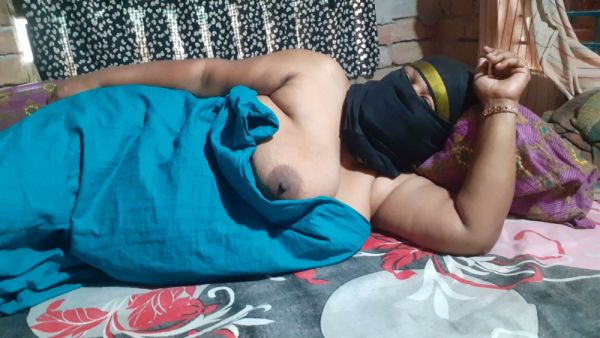 Dark-skinned woman in a mask takes deep on the floral bed on breastful.com