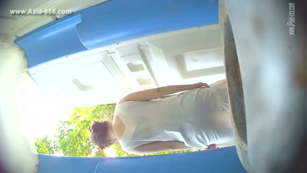 Two blonde women caught on hidden camera as one begins to urinate in a blue-tiled room on breastful.com