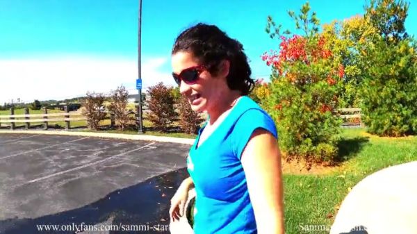 Mature woman explores outdoor spaces in sheer black leggings during a yoga-inspired solo session on breastful.com