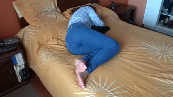 Alone on the yellow bed she pulls down her jeans and touches herself on breastful.com