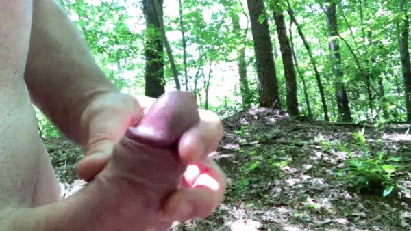 Man hikes naked through the forest while edging with his hand on his cock on breastful.com
