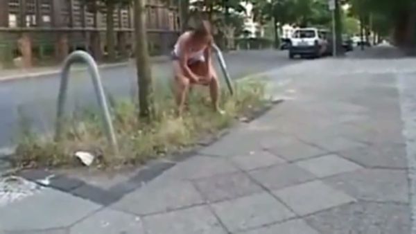 Young woman takes on multiple men in an outdoor gangbang with golden shower on breastful.com