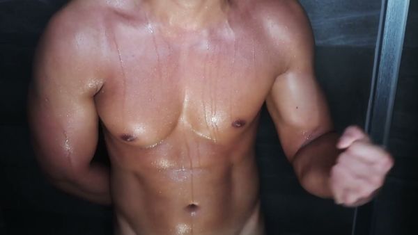 Muscular boyfriend flexes and submits under your gaze in the shower on breastful.com