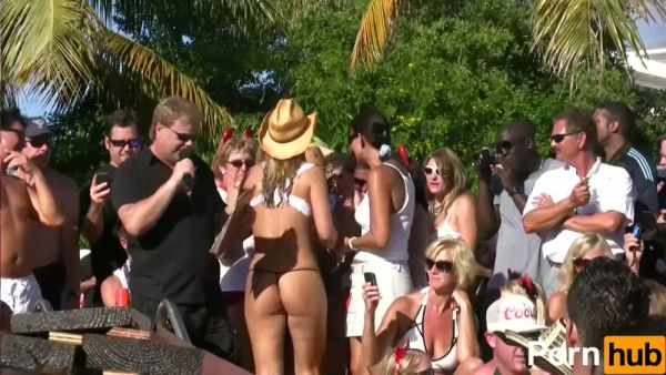 Blonde dancer in white bikini teased by water spray at tropical beach rave on breastful.com