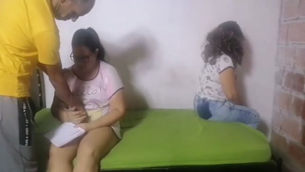 Arab doctor examines patient while colleague observes in the clinic on breastful.com