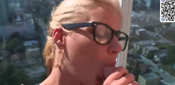 Busty blonde in glasses showcases off her fake mounds while wearing green leggings on breastful.com