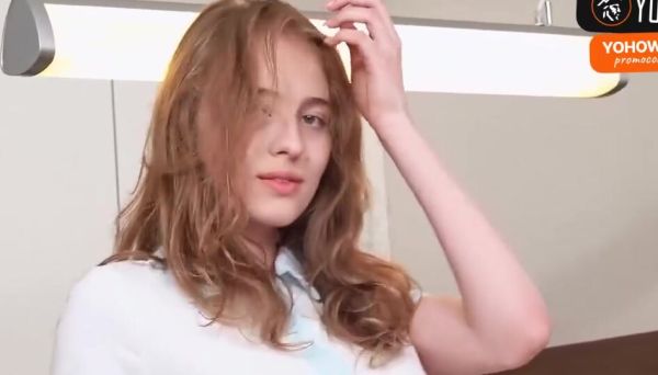 Busty redhead plays with faux-cock in her kitchen on breastful.com