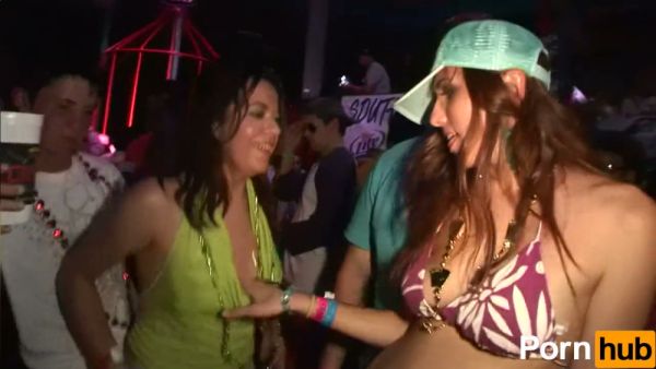 Curvy bikini dancer commands the crowd at a chaotic neon-lit party concert on breastful.com