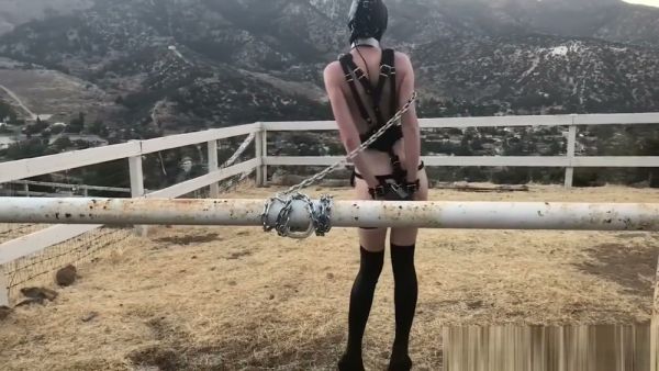 Solo pony play session in leather mask and harness out in the countryside on breastful.com