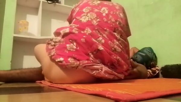 Indian woman with small breasts bends over on an orange mat at home - India on breastful.com